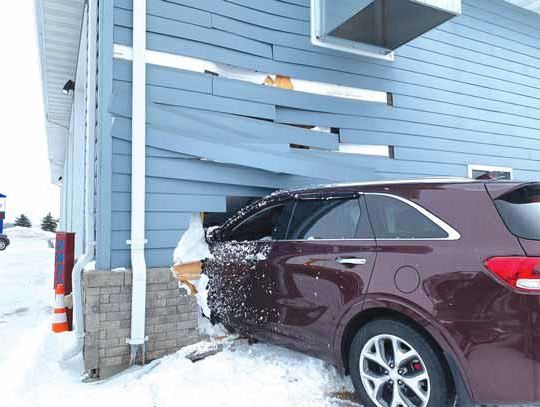 Car Crashes Through Fire Hall