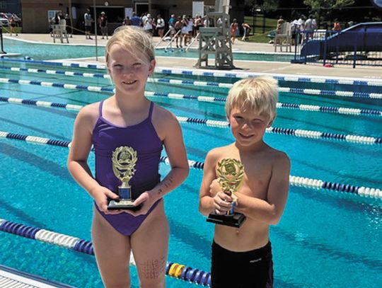 SWIMMERS COMPETE AT WEBSTER